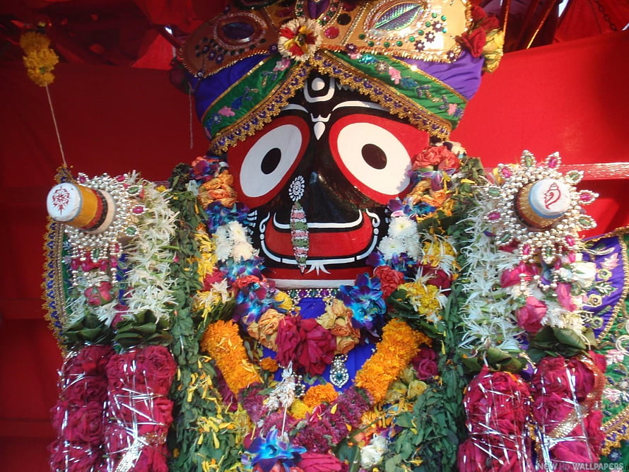 Jagannath Deity Adorned With Vibrant Flower Garlands And Ornate Crown HD wallpaper