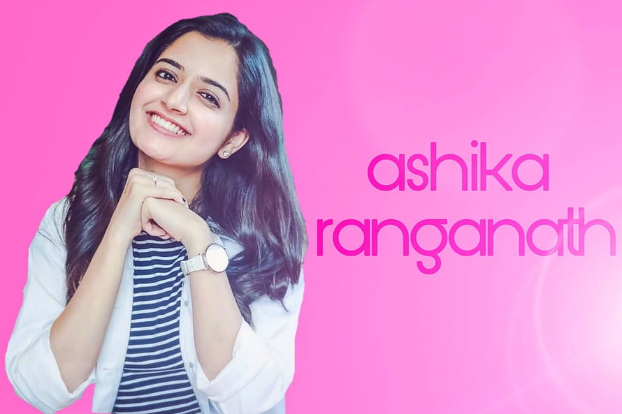 Ashika Ranganath smiling portrait on a vibrant pink background HD wallpaper
