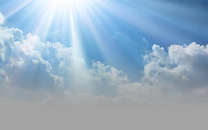 Sunbeams Breaking Through Clouds in a Serene Blue Sky HD wallpaper