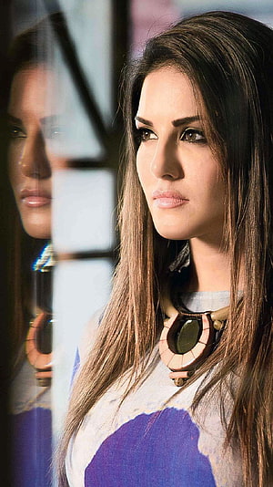 Sunny Leone Portrait with Reflection in Glass and Statement Necklace HD phone wallpaper