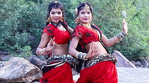 Hansa Rangili Dancers in Traditional Red Attire Performing Folk Dance Outdoors HD wallpaper
