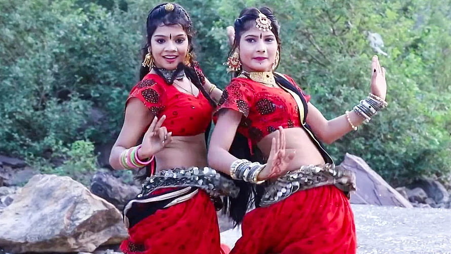 Hansa Rangili Dancers in Traditional Red Attire Performing Folk Dance Outdoors HD wallpaper