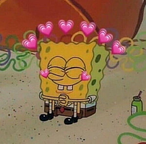 SpongeBob SquarePants with floating pink hearts and a contented smile HD wallpaper
