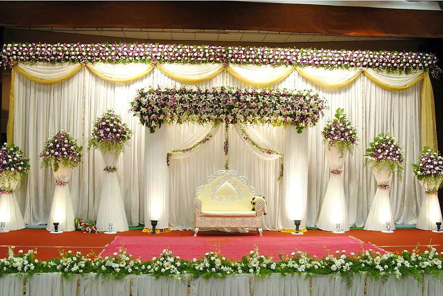 Elegant Indian Wedding Stage with Floral Drapes and Ornate Seating HD wallpaper
