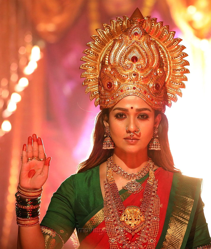 Nayanthara as Mookuthi Amman in ornate gold crown and traditional red and green sari HD phone wallpaper