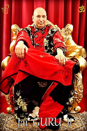 Guruji Portrait in Red and Gold Attire Seated on Ornate Throne HD phone wallpaper