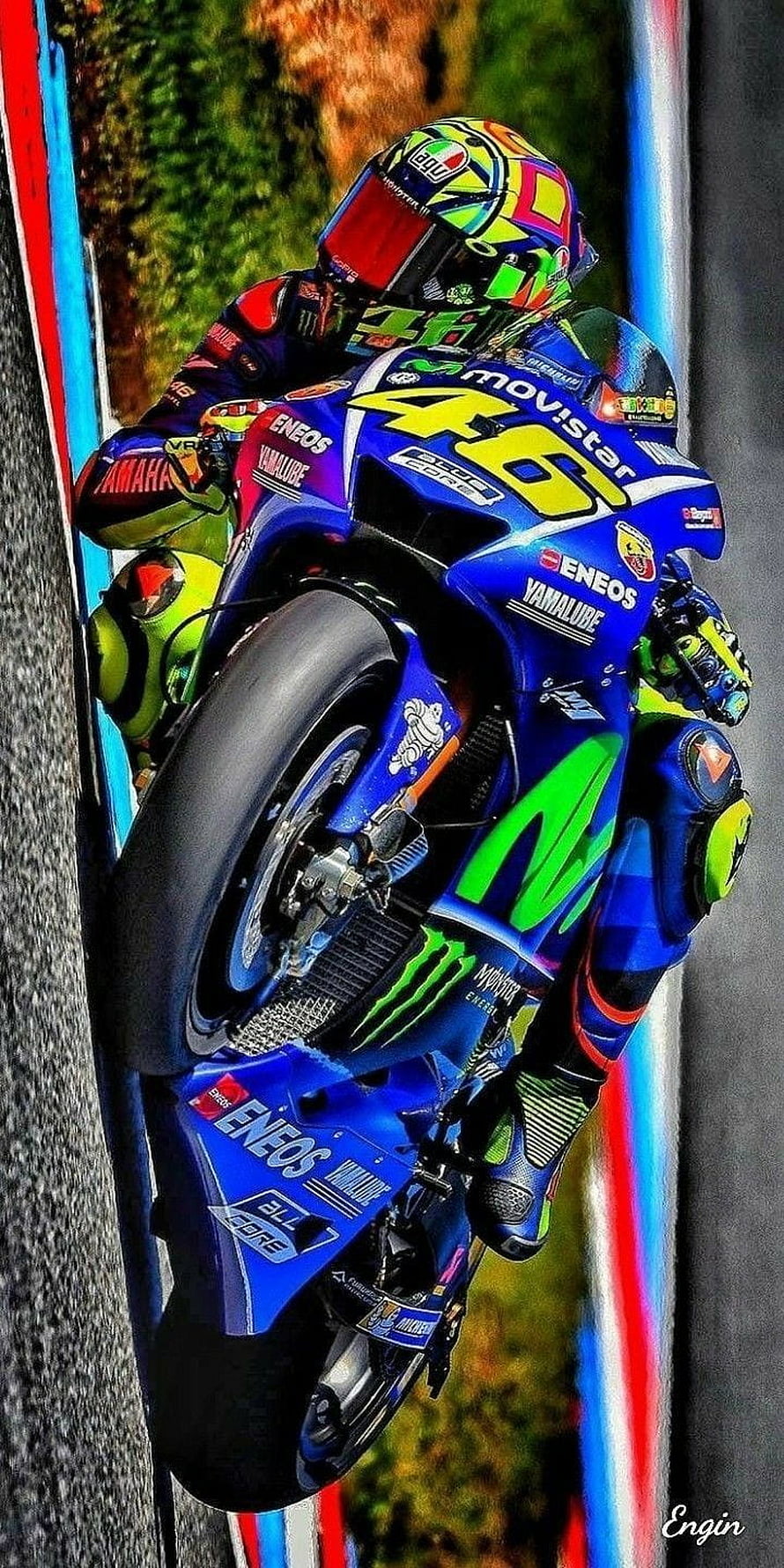 Valentino Rossi Riding Blue Yamaha YZR-M1 Motorcycle During MotoGP Race HD phone wallpaper