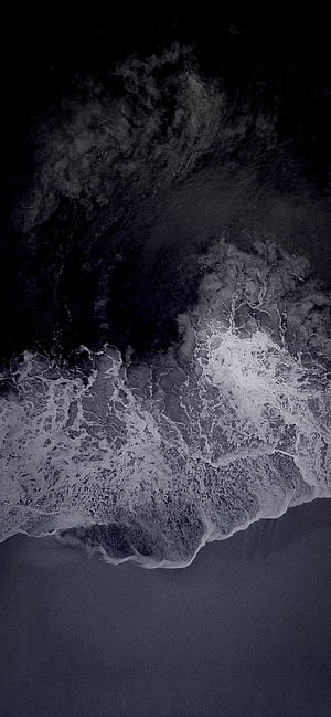 Dark Ocean Waves Crashing on Shore in Monochrome Aerial View HD phone wallpaper