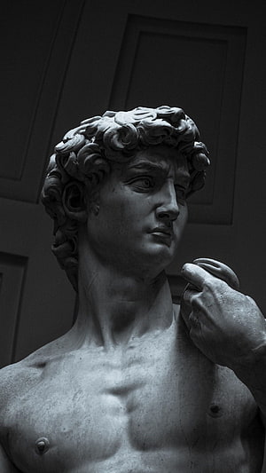 Monochrome Close-Up of Michelangelo's David Marble Statue in Dramatic Low-Key Lighting HD phone wallpaper
