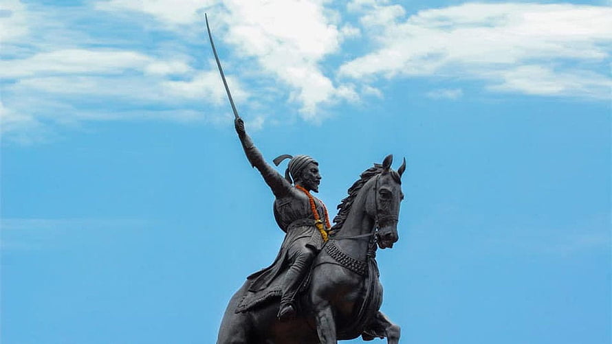 Chhatrapati Shivaji Maharaj Equestrian Statue with Raised Sword Against Blue Sky HD wallpaper