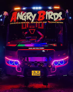 Kerala Tourist Bus with Neon LED Lights and Angry Birds Decal at Night HD phone wallpaper