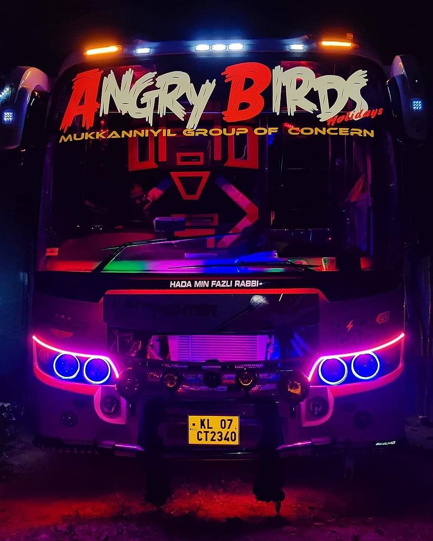 Kerala Tourist Bus with Neon LED Lights and Angry Birds Decal at Night HD phone wallpaper