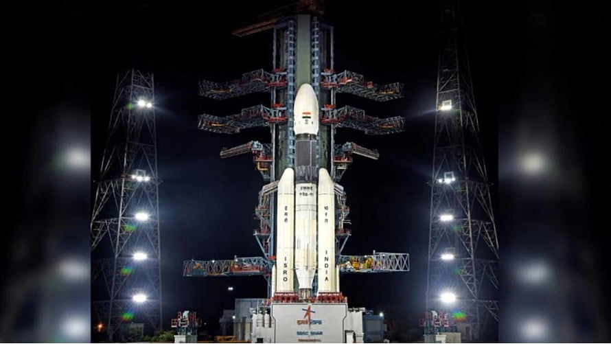 ISRO Chandrayaan Rocket on Launch Pad at Night with Illuminated Service Tower HD wallpaper