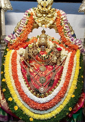 Chamundeshwari Goddess Ornamented With Vibrant Flower Garlands And Gold Jewelry HD phone wallpaper