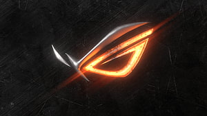 Asus ROG Strix Glowing Eye Logo on Dark Textured Background HD wallpaper