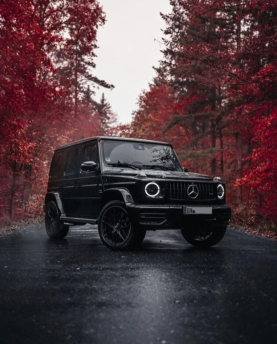 Black Brabus G63 AMG SUV on a Wet Forest Road with Red Autumn Foliage HD phone wallpaper