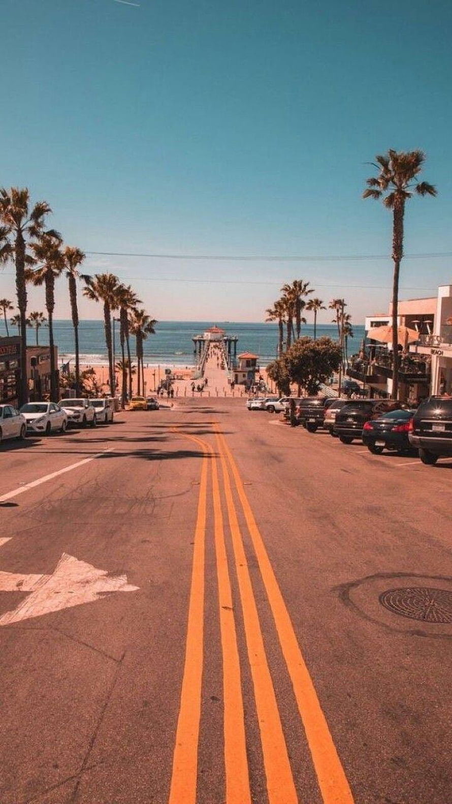 Vintage California Coastal Street Leading to Ocean Pier with Palm Trees HD phone wallpaper