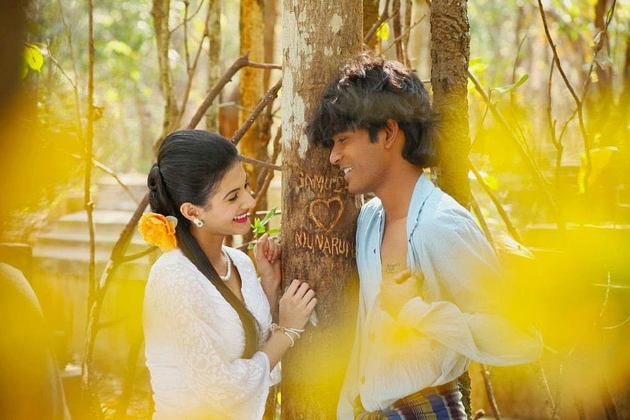Anegan Dhanush and Actress in Romantic Forest Scene HD wallpaper