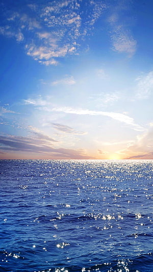 Sunset Over the Open Ocean with Sparkling Water and Scattered Clouds HD phone wallpaper