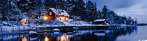 Cozy Red Log Cabin with Warm Lights on a Snowy Lake Shore at Dusk HD wallpaper