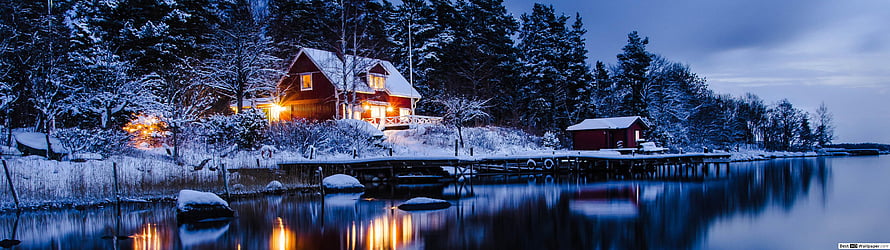 Cozy Red Log Cabin with Warm Lights on a Snowy Lake Shore at Dusk HD wallpaper