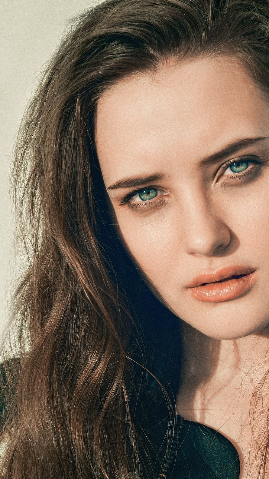 Katherine Langford Close-Up Portrait with Striking Green Eyes and Long Brown Hair HD phone wallpaper