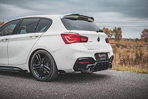 White BMW M140i Rear Three-Quarter View with Black Alloy Wheels and Sporty Diffuser HD wallpaper