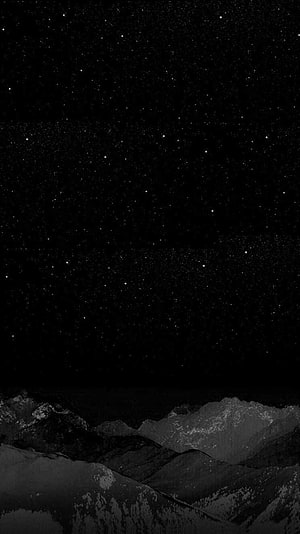 Monochrome Winter Mountain Range Under a Starry Night Sky HD phone wallpaper