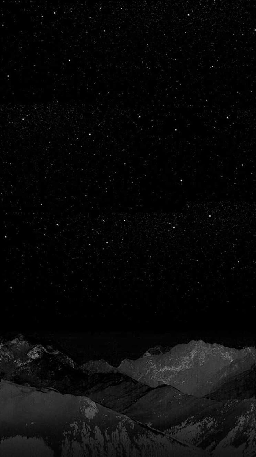 Monochrome Winter Mountain Range Under a Starry Night Sky HD phone wallpaper