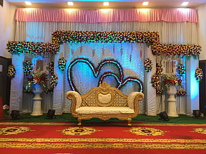 Elegant Wedding Reception Stage With Heart Floral Backdrop And Gold Sofa HD wallpaper