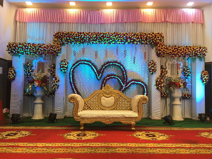 Elegant Wedding Reception Stage With Heart Floral Backdrop And Gold Sofa HD wallpaper