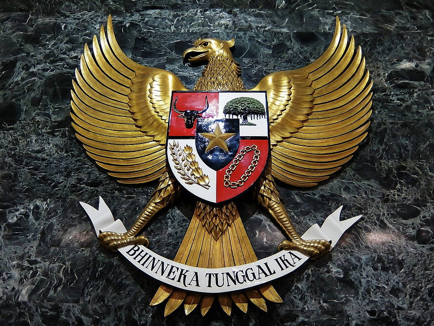 Golden Garuda Pancasila Emblem with National Coat of Arms on Dark Marble Background HD wallpaper