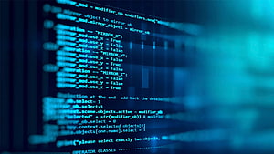 Blue Tinted Computer Code On Screen With Shallow Depth Of Field HD wallpaper