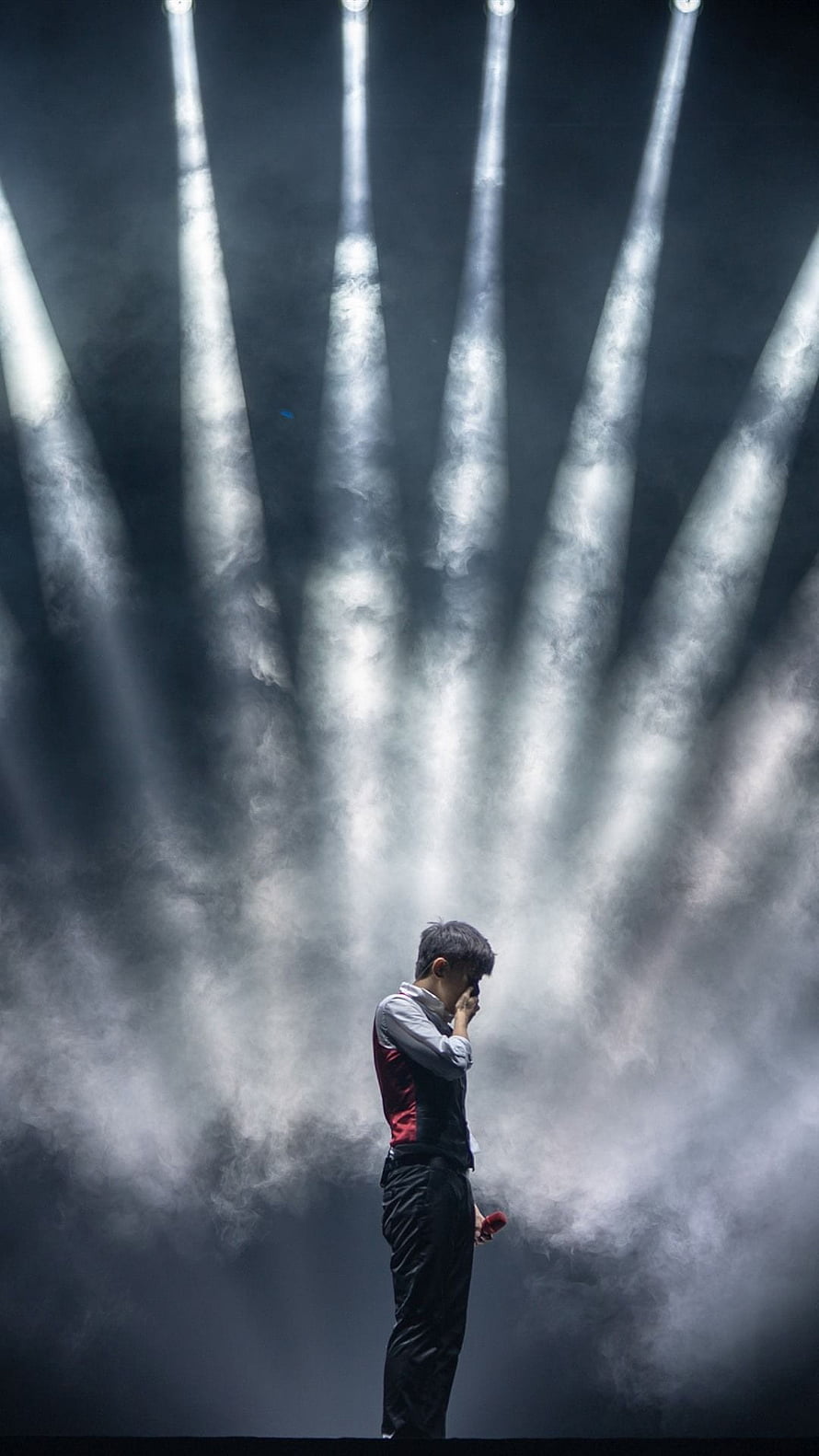 Emotional Male Singer Performing on Stage with Dramatic Spotlights and Smoke HD phone wallpaper