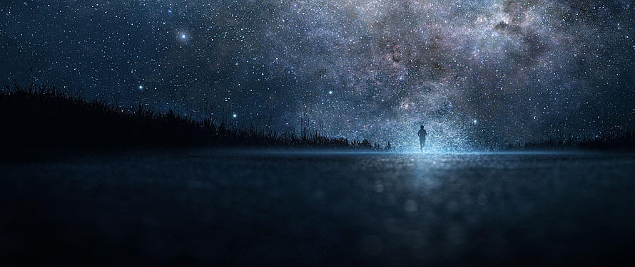 Silhouette of a lone figure standing on a misty shore beneath a vast star-filled night sky HD wallpaper