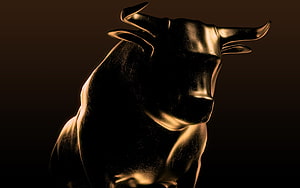 Dramatic Black Bull Sculpture with Golden Rim Lighting on Dark Background HD wallpaper
