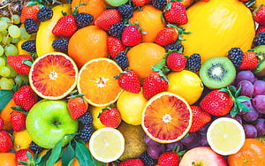 Vibrant Assortment of Fresh Citrus, Berries, and Tropical Fruits in a Colorful Composition HD wallpaper