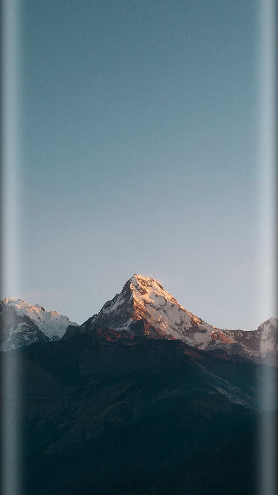 Majestic Snow-Capped Mountain Peak at Golden Hour with Clear Blue Sky HD phone wallpaper