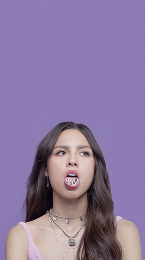 Olivia Rodrigo Sour Album Portrait with Playful Tongue Expression HD phone wallpaper