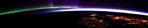 Earth From Space With Aurora Borealis And City Lights At Night HD wallpaper