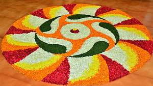 Traditional Onam Pookalam Flower Carpet Design with Vibrant Marigold and Rose Petals HD wallpaper