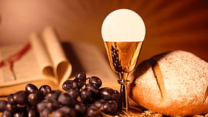 Sacred Eucharist Still Life With Golden Chalice, Bread, Grapes, And Open Bible HD wallpaper