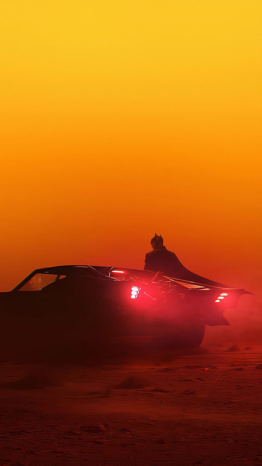 Batman Silhouette Standing Beside Batmobile Against Fiery Orange Sunset Sky HD phone wallpaper