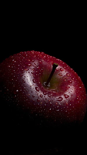 Glossy Red Apple with Water Droplets on Black Background HD phone wallpaper