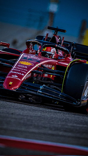 Ferrari Formula 1 Race Car on Track at Night with Sponsor Logos HD phone wallpaper