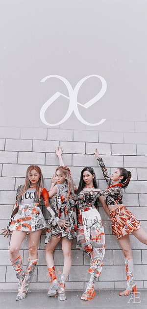 Aespa K-Pop Group in Matching Orange and White Streetwear Outfits HD phone wallpaper