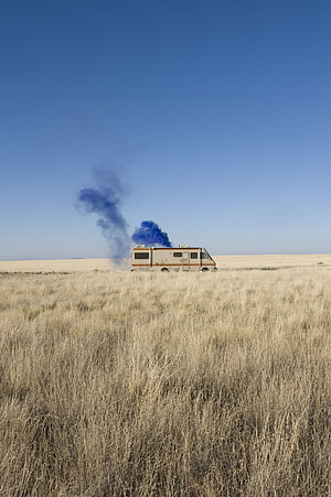 Breaking Bad RV in Desert with Blue Smoke Plume Under Clear Sky HD phone wallpaper