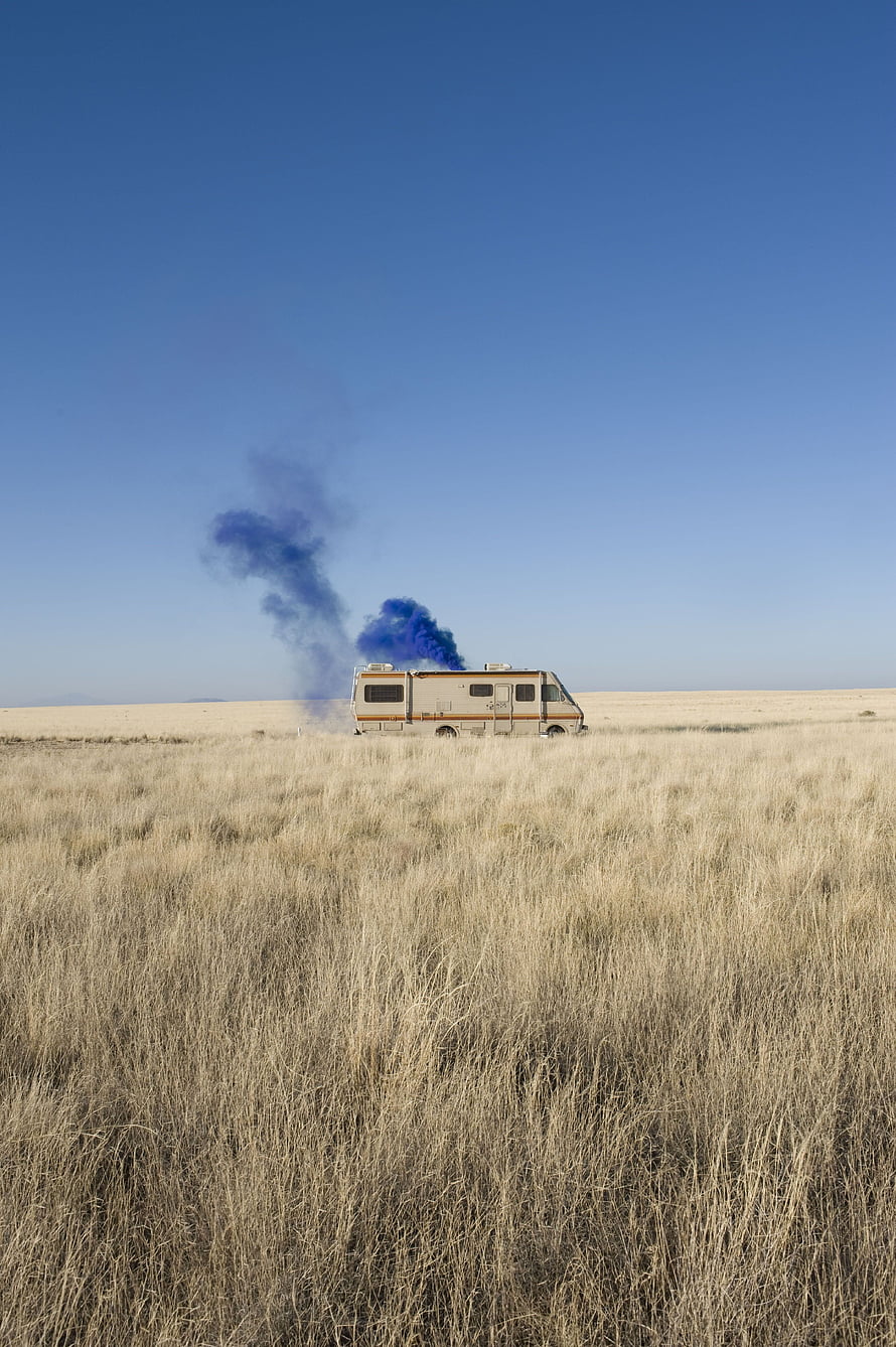 Breaking Bad RV in Desert with Blue Smoke Plume Under Clear Sky HD phone wallpaper