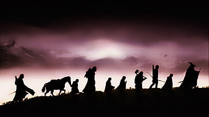 The Fellowship of the Ring Silhouette Walking at Dusk with Horse and Weapons HD wallpaper