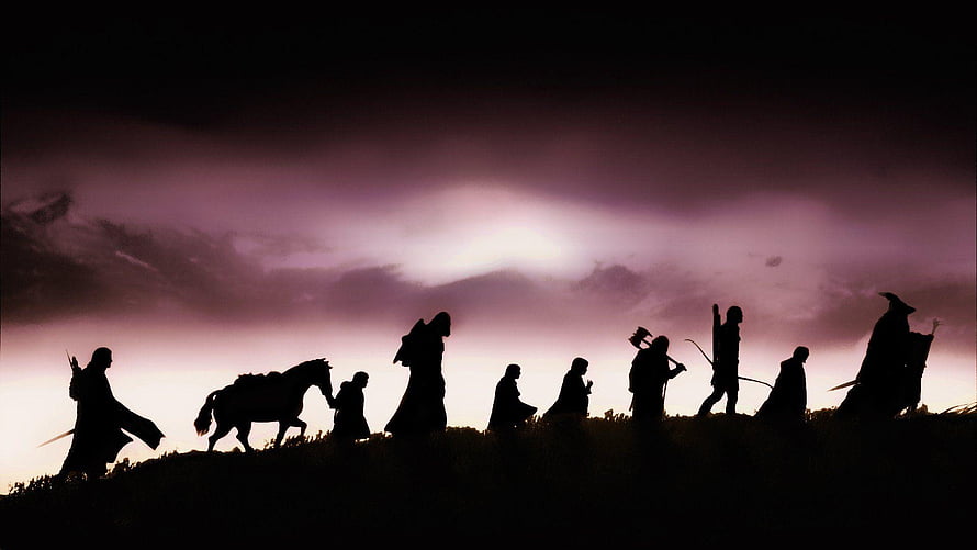 The Fellowship of the Ring Silhouette Walking at Dusk with Horse and Weapons HD wallpaper